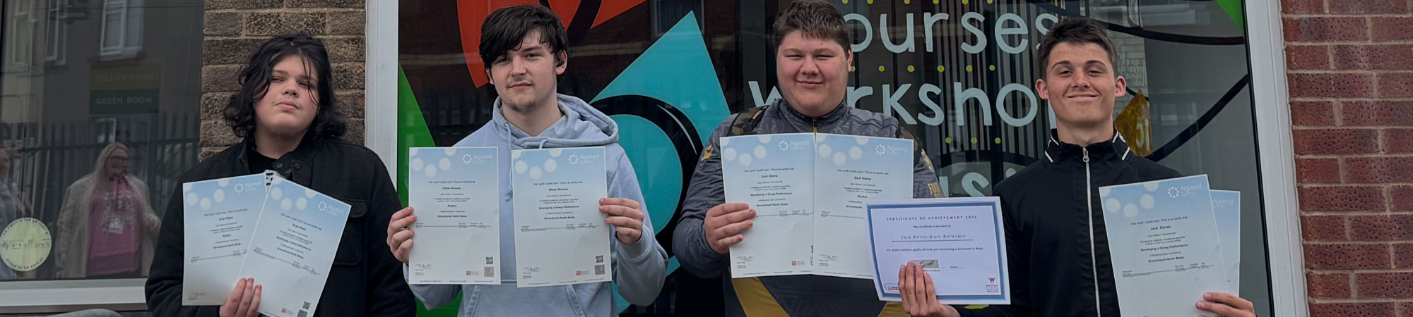 Teenagers with qualification certificates at Wrexham Sounds